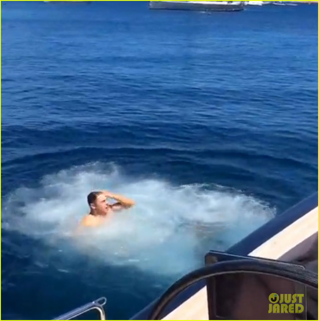 zac efron goes shirtless backflip off a boat 05