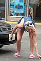miley cyrus picks something off the ground gas station 05