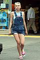 miley cyrus picks something off the ground gas station 08