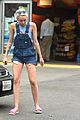 miley cyrus picks something off the ground gas station 11