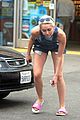 miley cyrus picks something off the ground gas station 12