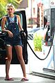 miley cyrus picks something off the ground gas station 17
