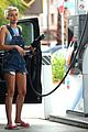 miley cyrus picks something off the ground gas station 18