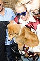miley cyrus smiles wide with puppy moonie 02