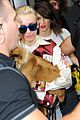 miley cyrus smiles wide with puppy moonie 06