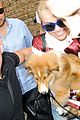 miley cyrus smiles wide with puppy moonie 08