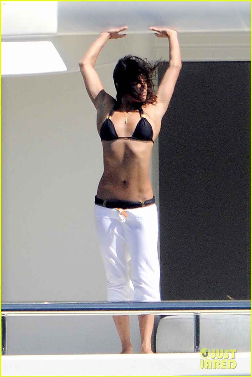 michelle rodriguez balances on the edge of a yacht 063172317