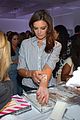 katie holmes gets temporary tattoos at joe zee nyfw event 15