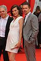 milla jovovich cradles baby bump at premiere 18