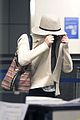 jennifer lawrence touches down at lax after serena 10