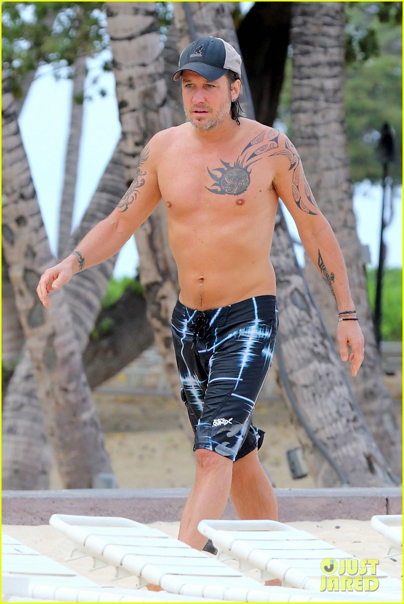 Keith Urban Puts His Shirtless Body on Display While Getting Wet in the