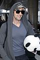 adrien brody travels around with his panda teddy bear 02