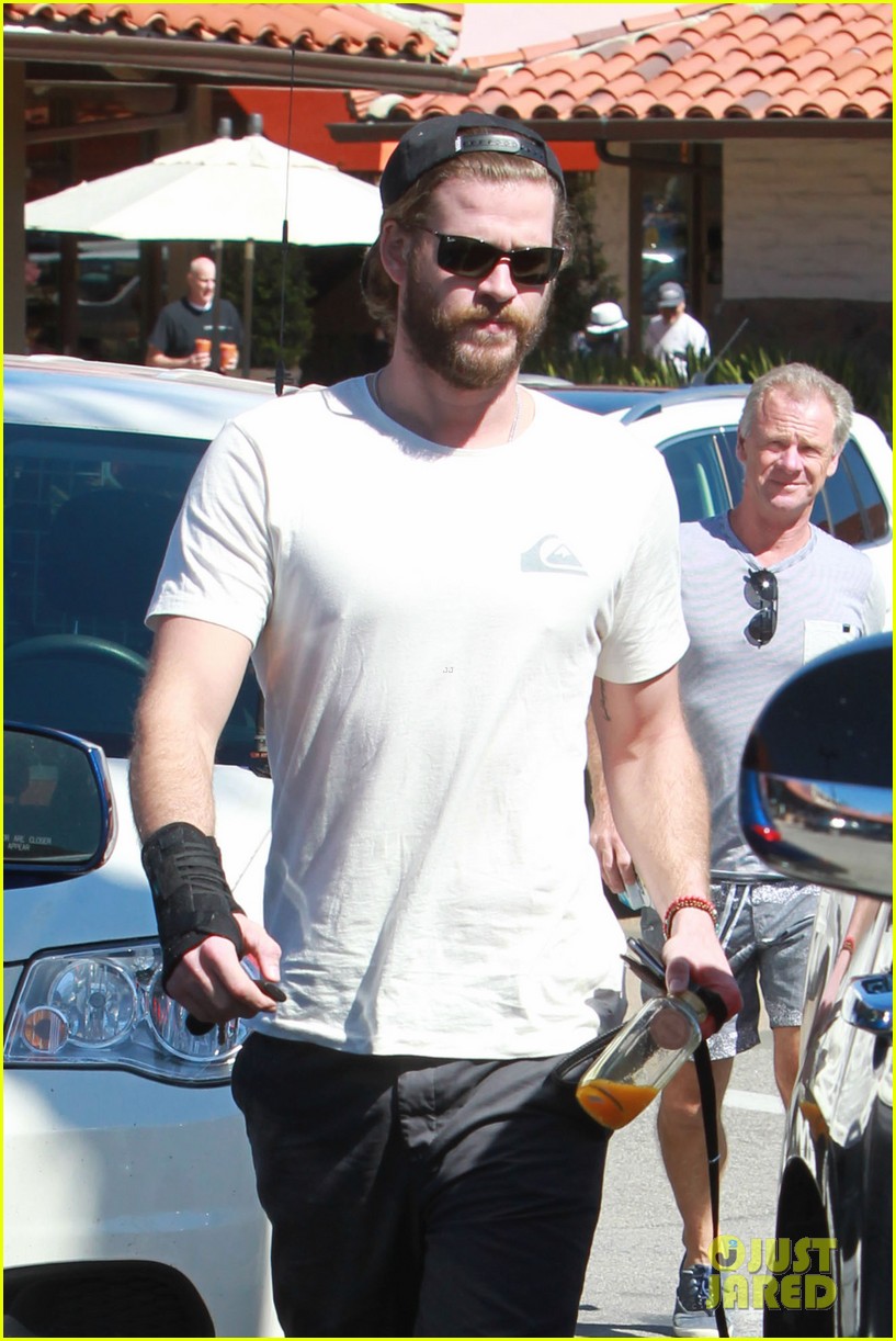 liam hemsworth pup out after independence day news 03