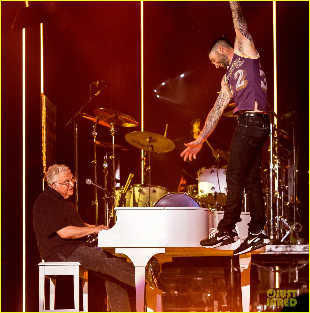fan attackes adam levine on stage during concert 033341643