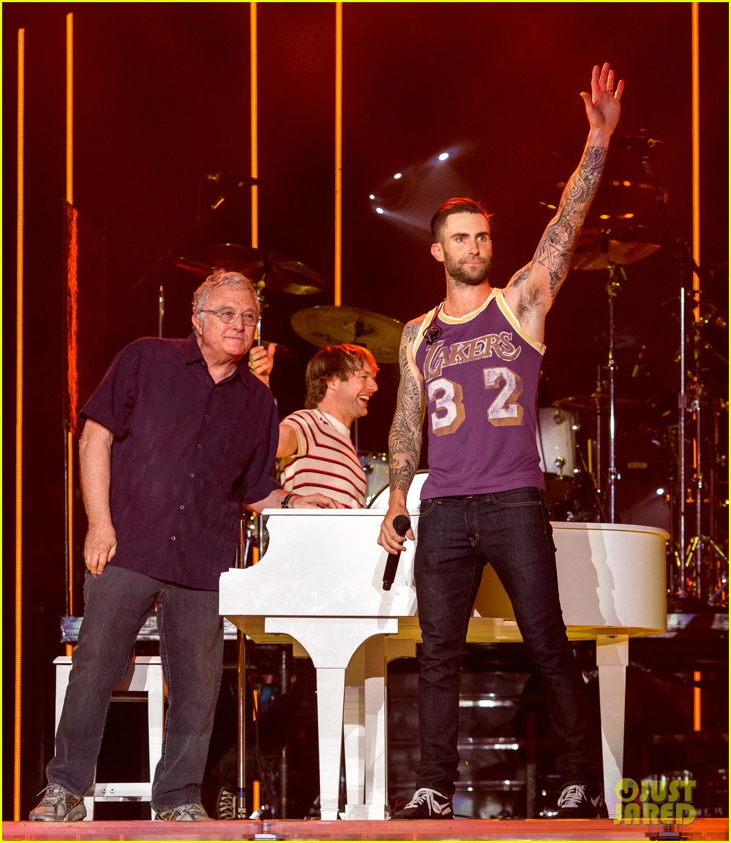 fan attackes adam levine on stage during concert 053341645
