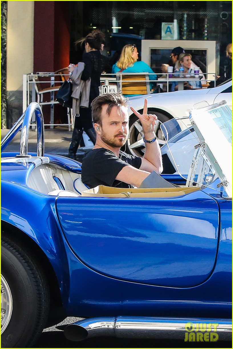 aaron paul flashes peace sign during drive 023343893