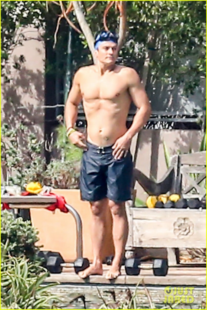 orlando bloom goes shirtless for outdoor swim weights workout 253397549