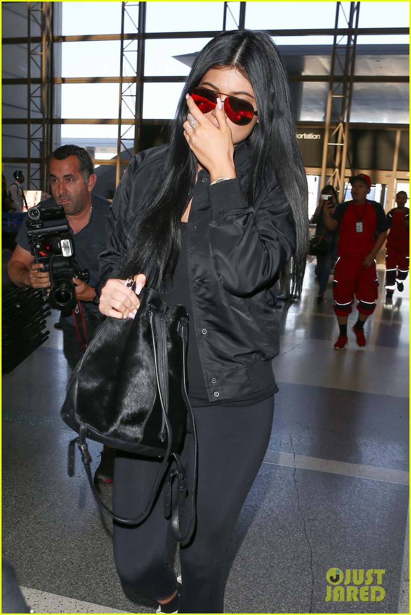 kylie jenner tyga wear matching black at lax airport 22