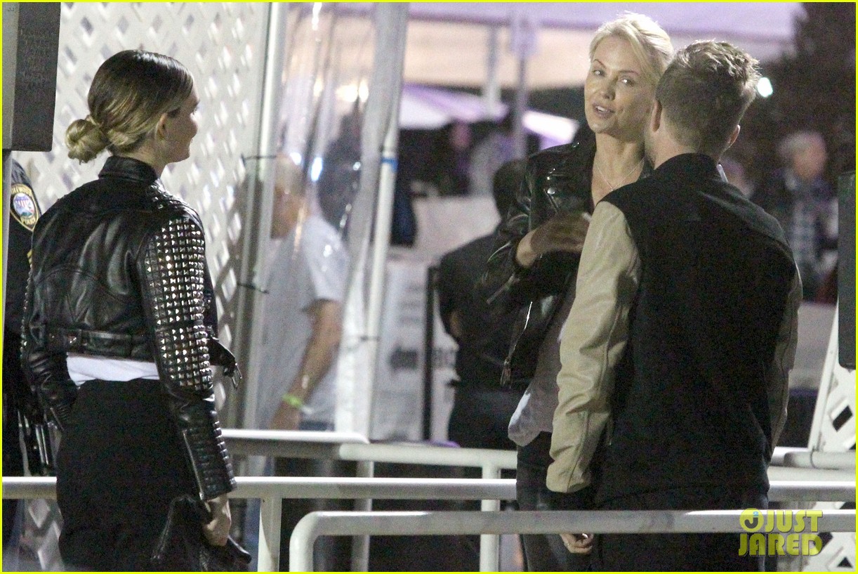 charlize theron aaron paul chat it up at u2 concert 183386220