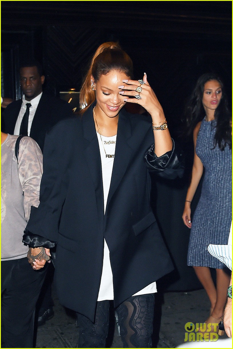 rihanna wears thigh high boots with an oversized suit jacket 11