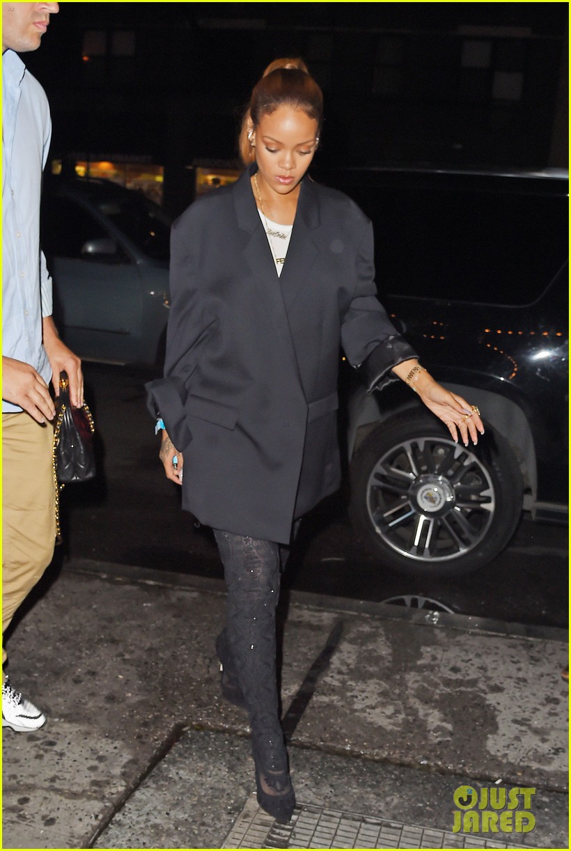 rihanna wears thigh high boots with an oversized suit jacket 273412637