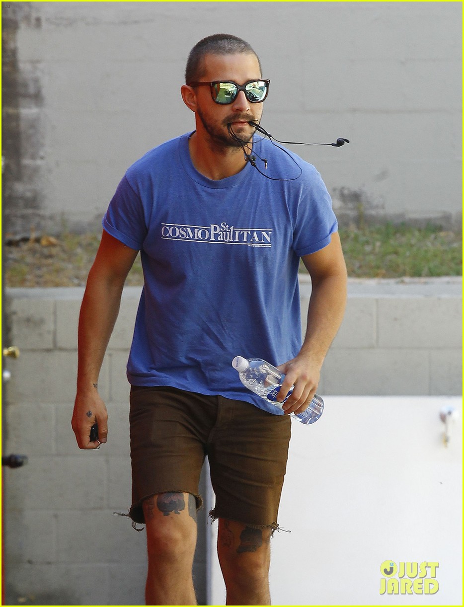 shia labeouf carries headphones in mouth 103470185
