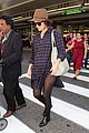 rose byrne covers baby bump in loose fitting shirt 03