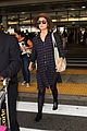 rose byrne covers baby bump in loose fitting shirt 07
