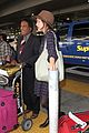 rose byrne covers baby bump in loose fitting shirt 09