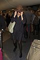 rose byrne covers baby bump in loose fitting shirt 11