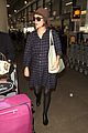 rose byrne covers baby bump in loose fitting shirt 14