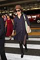 rose byrne covers baby bump in loose fitting shirt 18