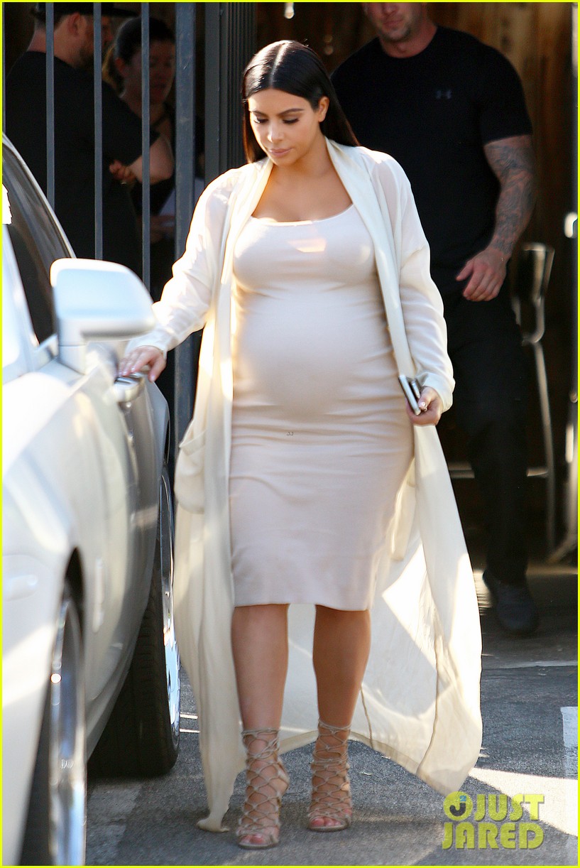 pregnant kim kardashian displays baby bump in another form fitting dress 13