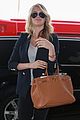 kate upton jets out of town after lacma rain 23