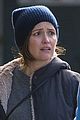 rose byrne makes a face while on a walk 03
