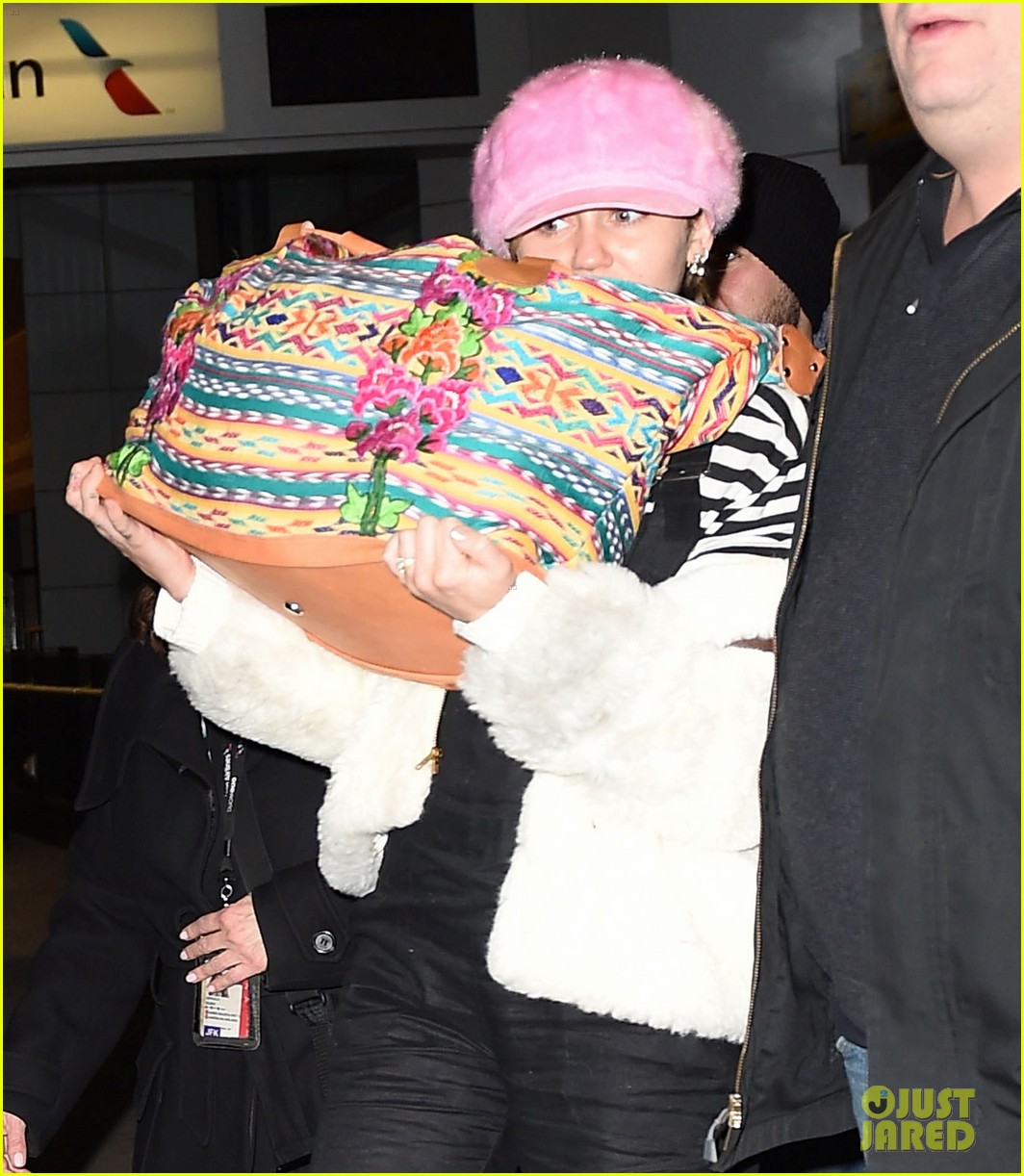 miley cyrus wears ring at airport 273554959