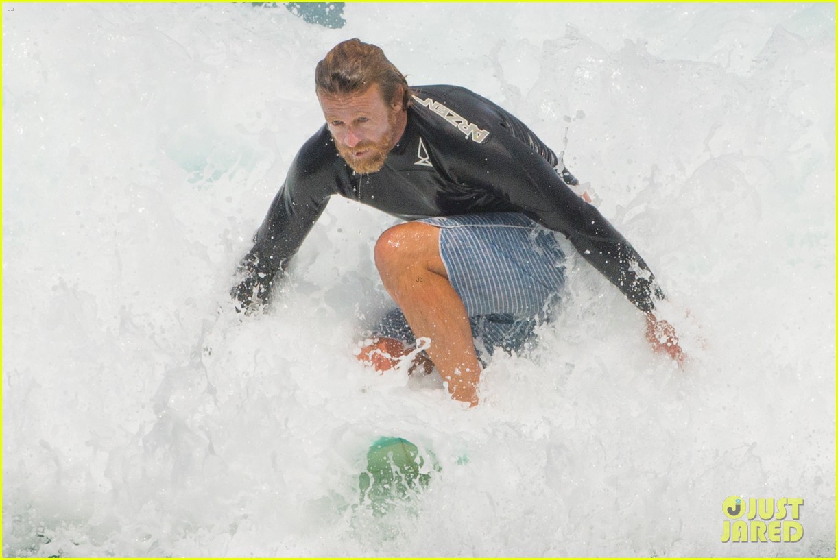 simon baker goes scruffy while catching waves in sydney 02