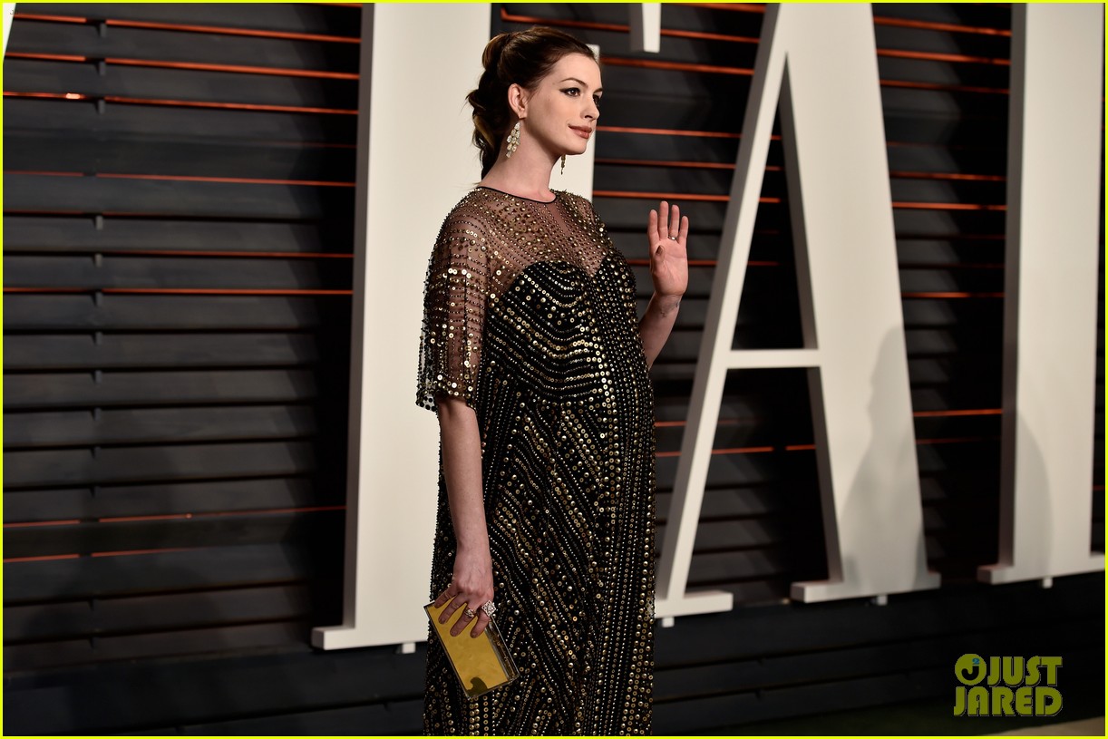 Pregnant Anne Hathaway Displays Baby Bump at Vanity Fair Oscars Party