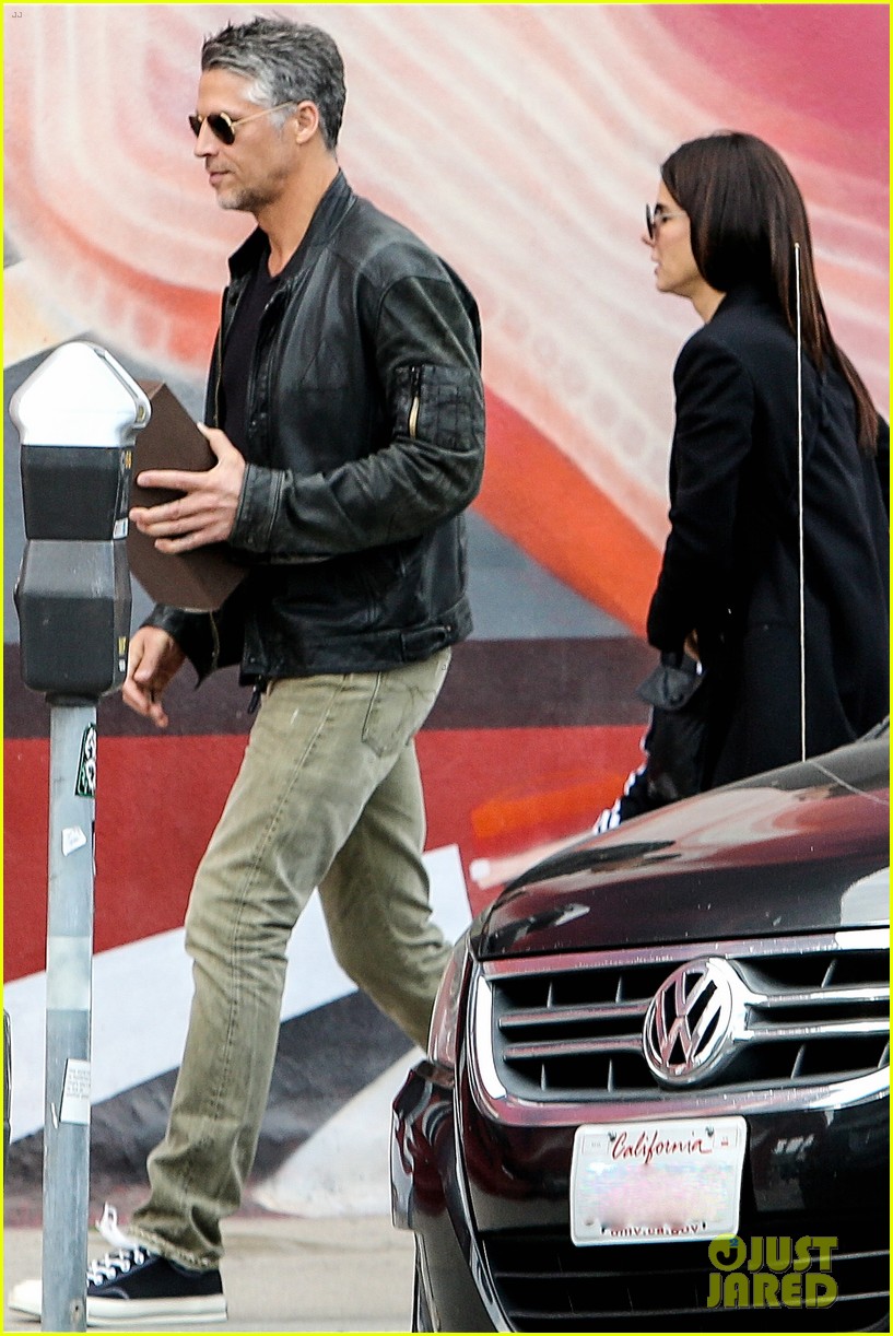 sandra bullock hides face while out with bae 123597703