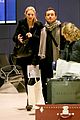 jude law and his bae walk around the airport 01