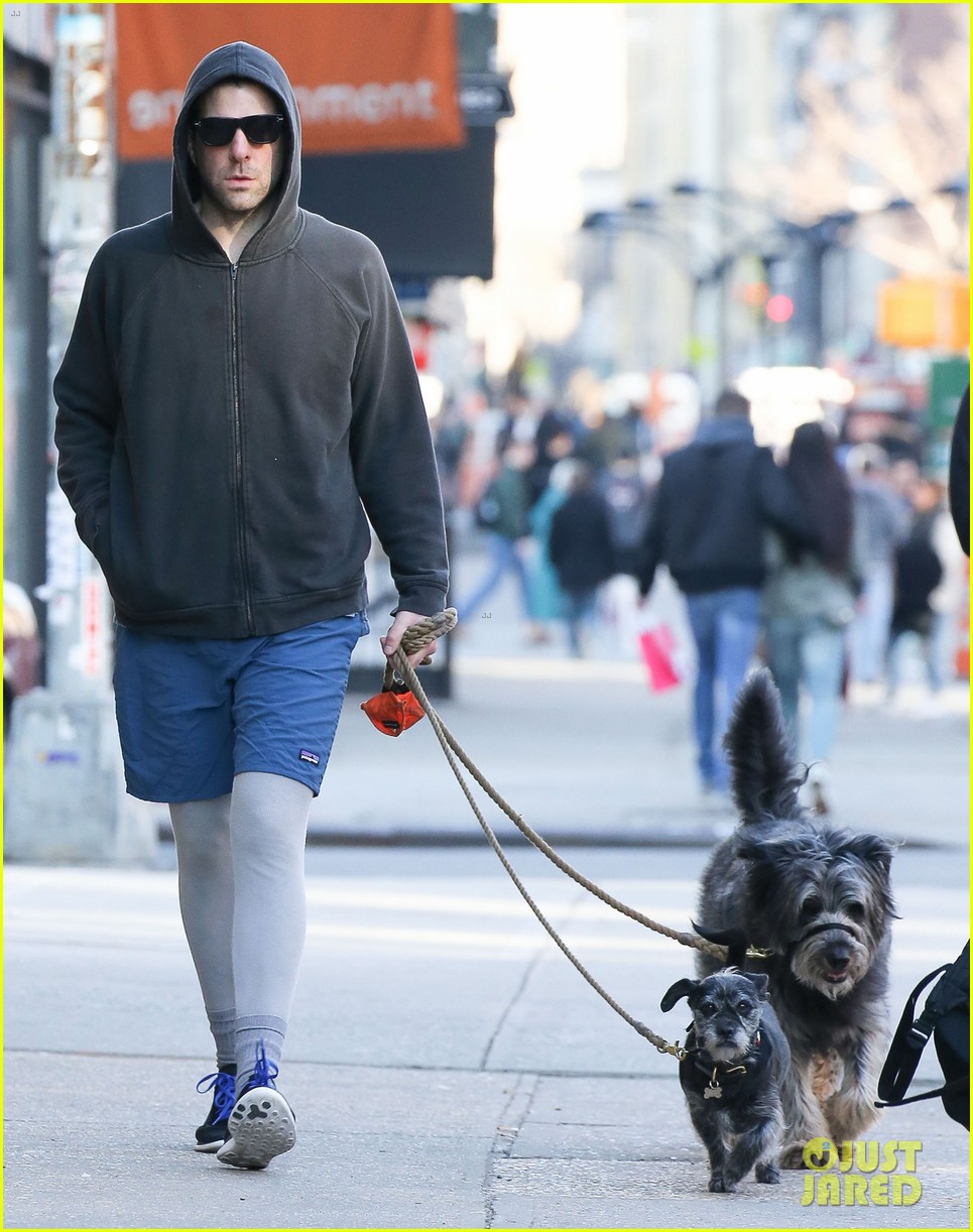 zachary quinto wears shorts over pants to walk his dogs 053600769