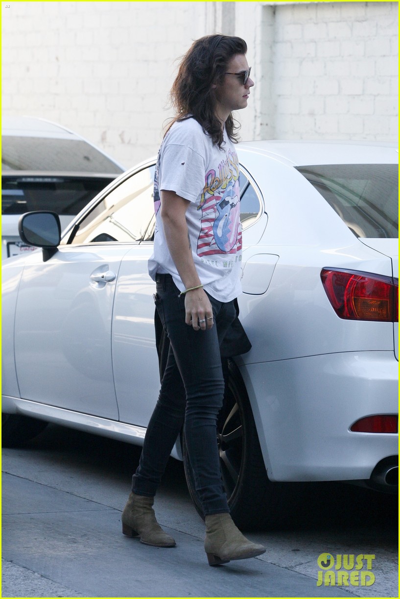 harry styles sports vintage style while shopping at saint laurent 19