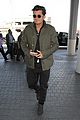 orlando bloom pulls off cool airport style for trip to paris 01