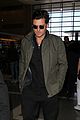 orlando bloom pulls off cool airport style for trip to paris 02