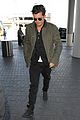 orlando bloom pulls off cool airport style for trip to paris 07