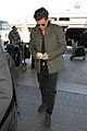 orlando bloom pulls off cool airport style for trip to paris 10