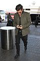 orlando bloom pulls off cool airport style for trip to paris 11
