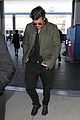 orlando bloom pulls off cool airport style for trip to paris 14