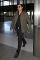 orlando bloom pulls off cool airport style for trip to paris 15