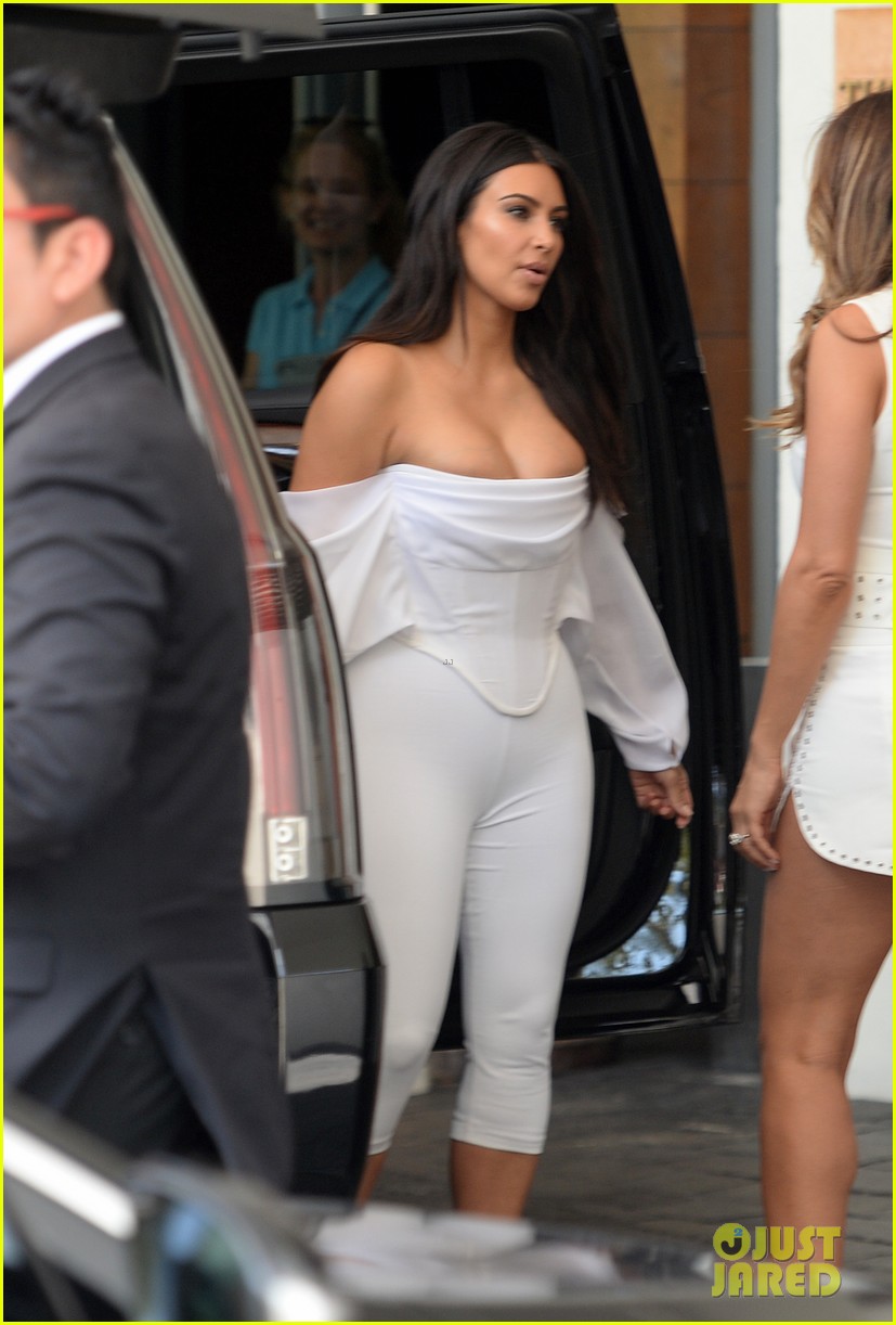 kim kardashian flaunts curves cleavage in white jumpsuit 133638512